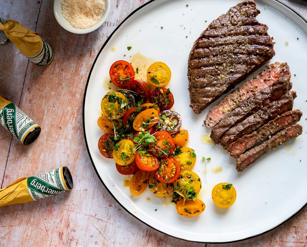 Underberg Steak With Herb Butter, Tomato Salad, and Bread
